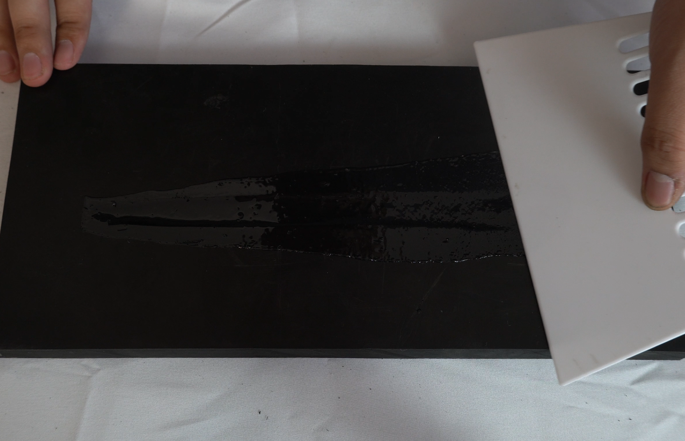 smooth out the adhesive