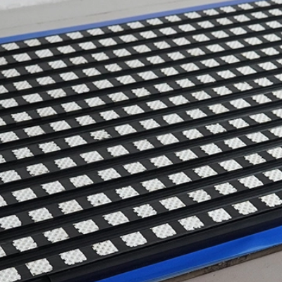 Detail shot of ceramic tiles and belt friction